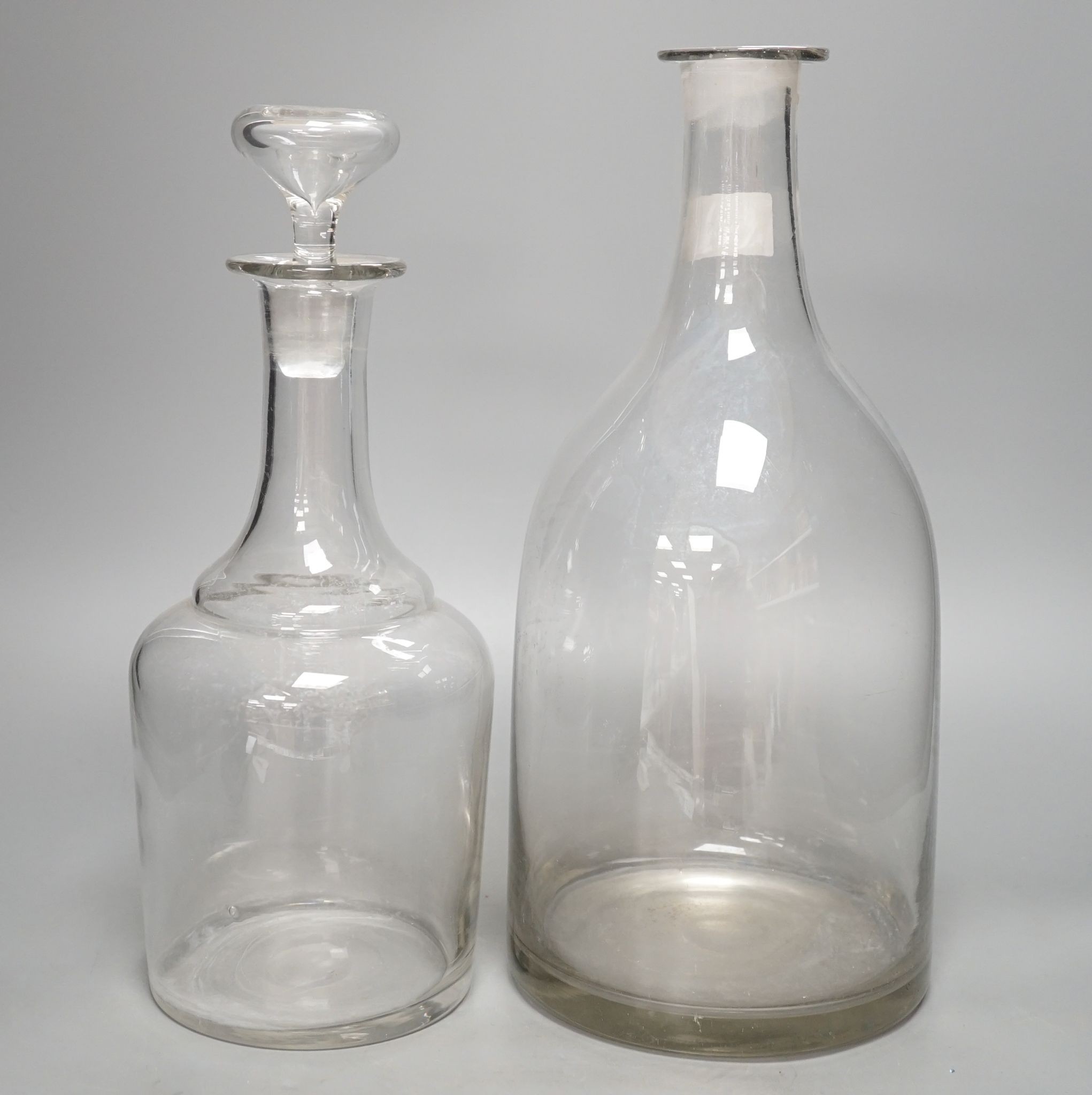 Two Normandy glass cider carafes, tallest 38cm